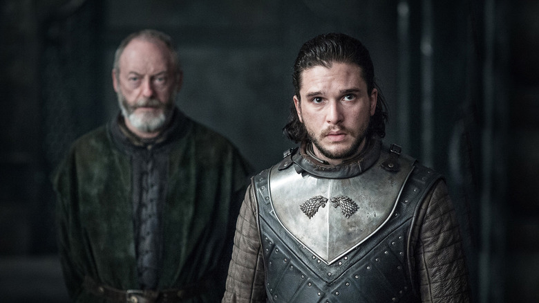 Jon in Stark armor looking forward with Davos behind him in Game of Thrones