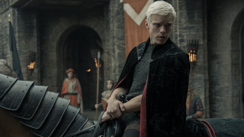 Finn Bennett as Aerion Targaryen looking down from his horse in A Knight of the Seven Kingdoms