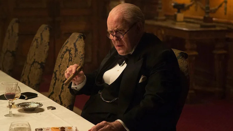 John Lithgow's Winston Churchill smoking a cigar on The Crown