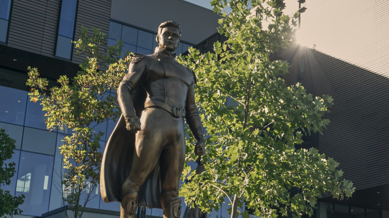 A statue of Antony Starr as Homelander at Godolkin University campus on Gen V