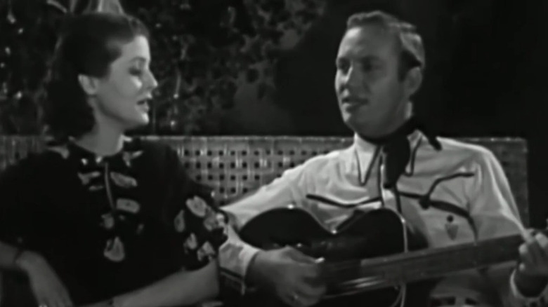 Mary Ann Lee and Gene Autry sitting together in Oh, Susanna!