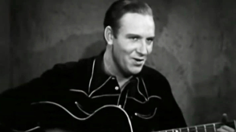 Gene Autry playing the guitar in Oh, Susanna!