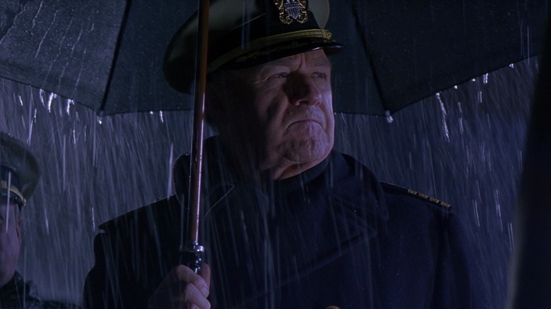 Captain Frank Ramsey standing in the rain in Crimson Tide
