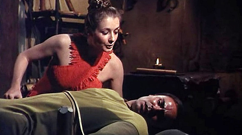 Marg (Diana Muldaur) speaks to a restrained Dylan Hunt (John Saxon) in Planet Earth