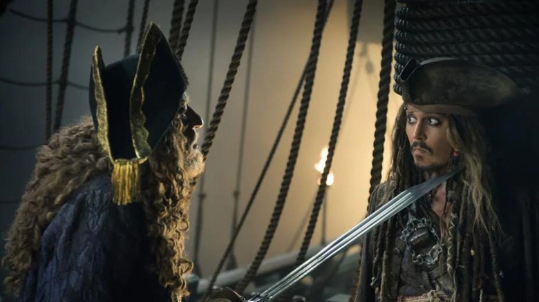 Geoffrey Rush and Johnny Depp as Captain Barbossa and Jack Sparrow in Pirates of the Caribbean