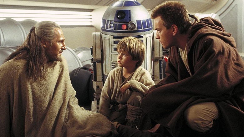 Liam Neeson, Jake Lloyd, and Ewan McGregor in Star Wars: The Phantom Menace