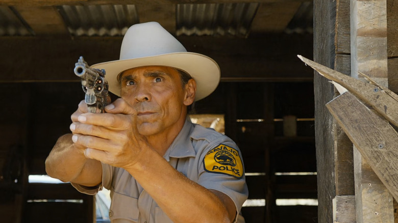 Joe Leaphorn points a gun on Dark Winds