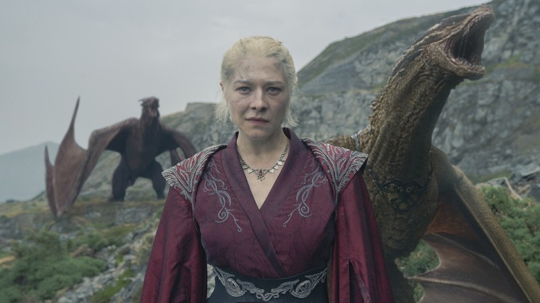 Emma D'Arcy as Princess Rhaenyra Targaryen backed by two roaring dragons in House of the Dragon