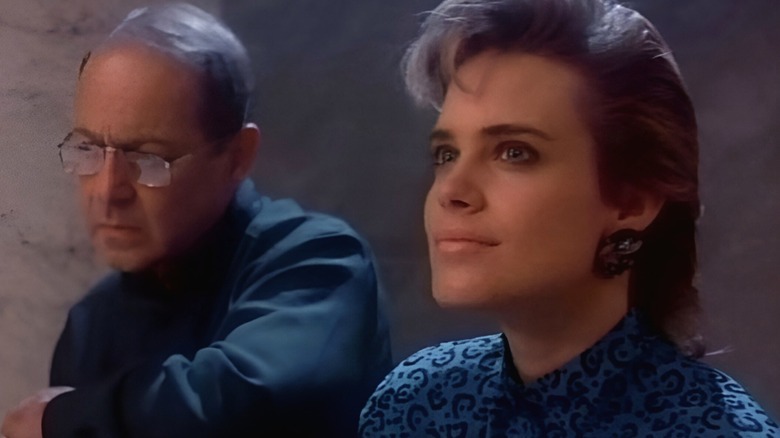 Michael D'Branin (John Standing) and Miranda Dorleac (Catherine Mary Stewart) discuss the mission in Nightflyers
