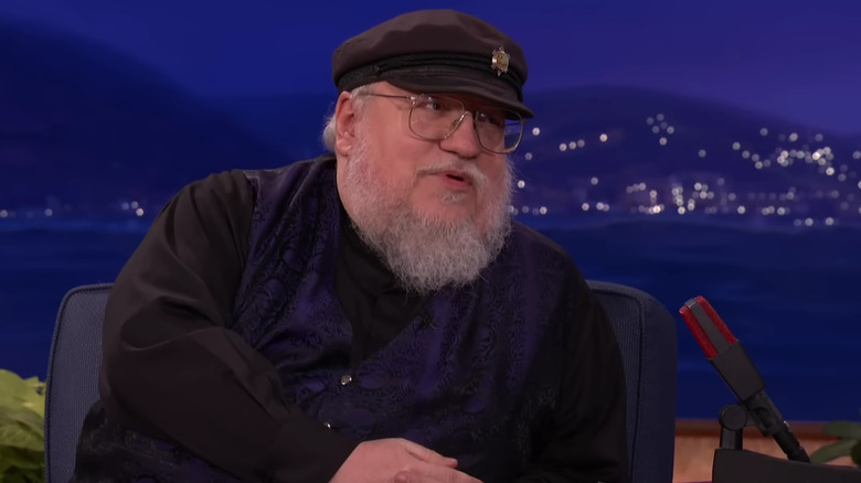 George R.R. Martin is wearing a black hat on Conan