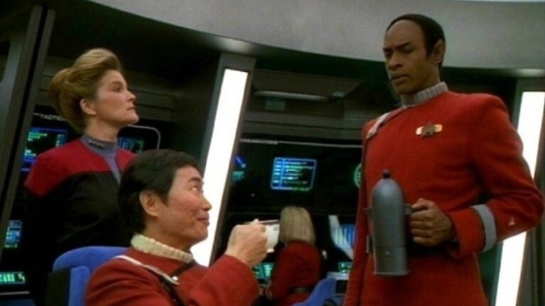 Tuvok serving coffee to Captain Sulu while Captain Janeway looks on on Star Trek: Voyager