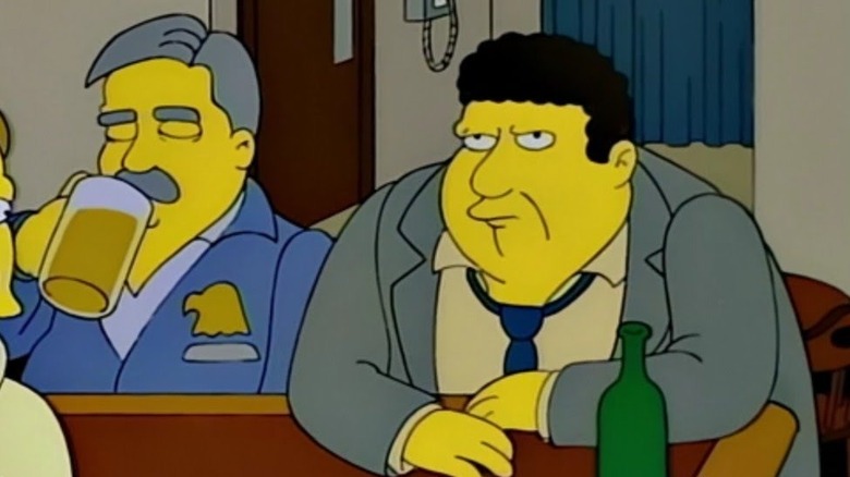 Geo rge wendt como norma sentado em um bar nos Simpsons