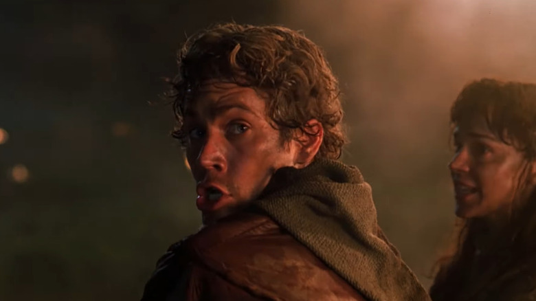 Paul Walker as Chris looking over his shoulder while running away from fire in Timeline