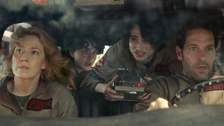 The Spenglers and Grooberson in the Ecto-1 in Ghostbusters: Frozen Empire