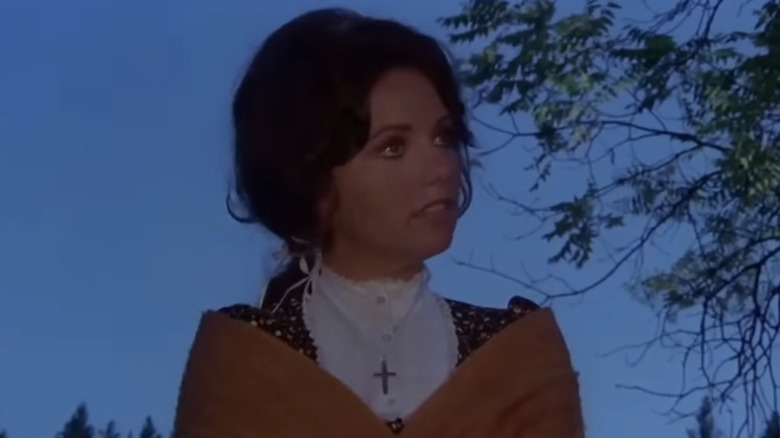 Dawn Wells' Clayanna is seen standing outside at night in Winterhawk