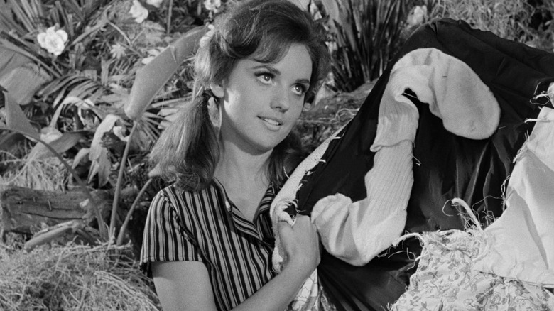 Mary Ann holding some cloth on Gilligan's Island