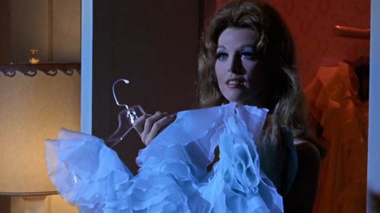 Lola Medina holding up a nightie in The Wrecking Crew