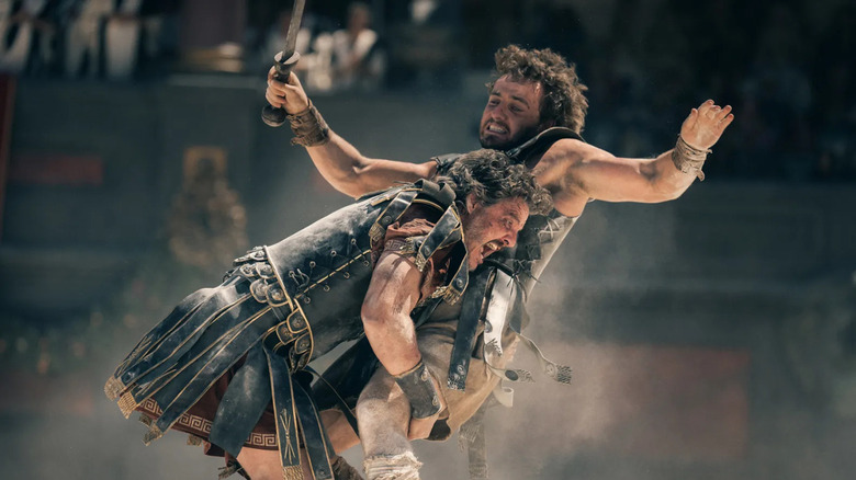 Acacius (Pedro Pascal ) tackles Lucius (Paul Mescal) in Gladiator 2