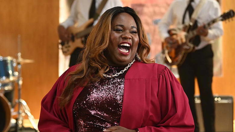 Alex Newell as Mo, singing with a band in Zoey's Extraordinary Playlist