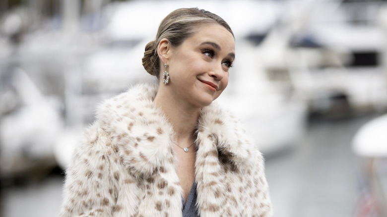 Becca Tobin as Brooke Mailer, smiling in fur in Turner and Hooch