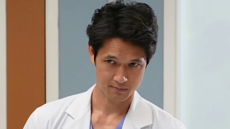 Harry Shum Jr. as Benson Kwan, looking suspicious in a hospital on Grey's Anatomy