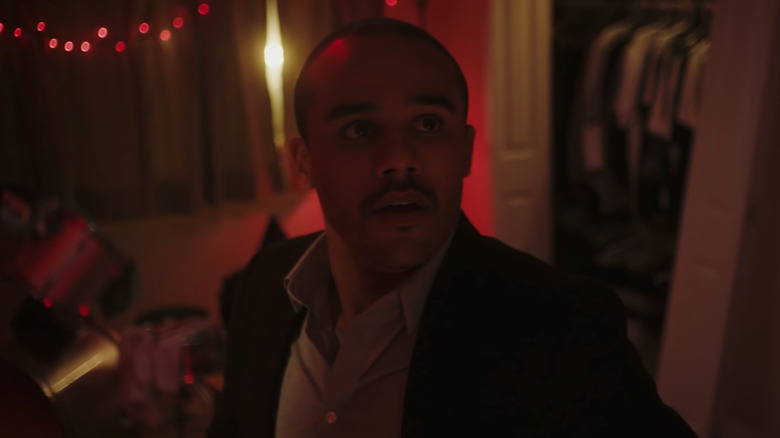 Jacob Artist as Damien, hiding in a bedroom in The Get Together