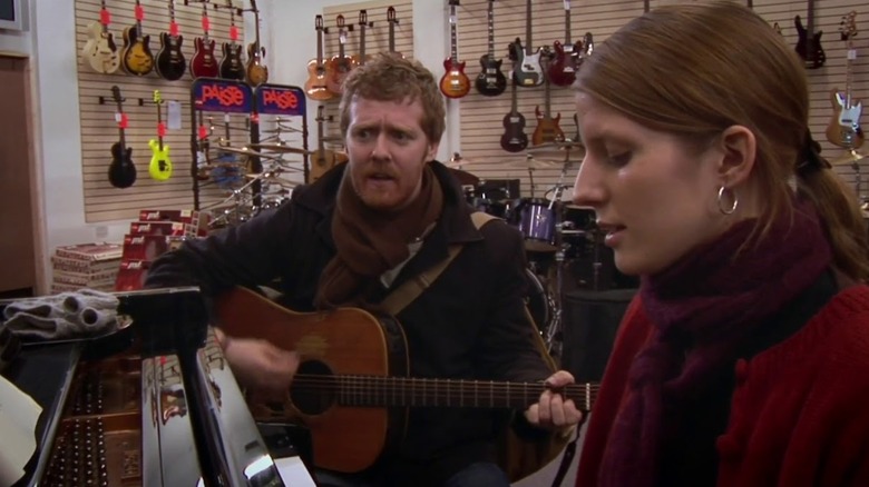 Guy and Girl singing Falling Slowly in a music shop in Once