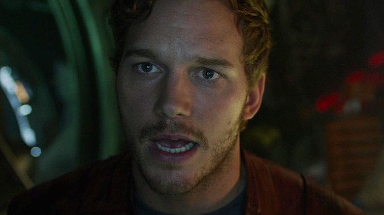 Chris Pratt as Star-Lord is seen in closeup standing on his ship in Guardians of the Galaxy