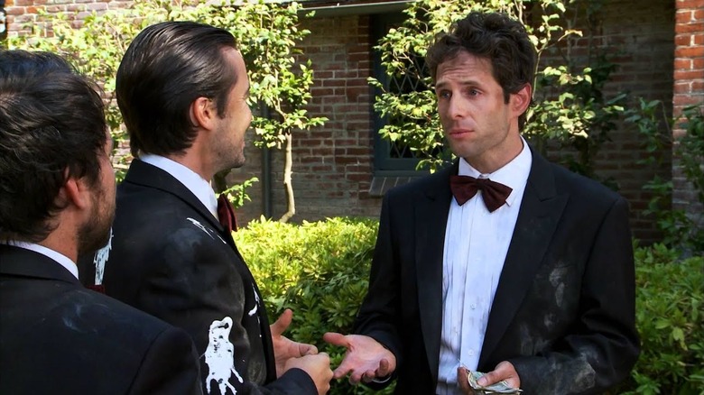 Charlie Kelly (Charlie Day), Mac (Rob McElhenney), and Dennis Reynolds (Glenn Howerton) wear tuxedos for their new trash business in "It's Always Sunny in Philadelphia"