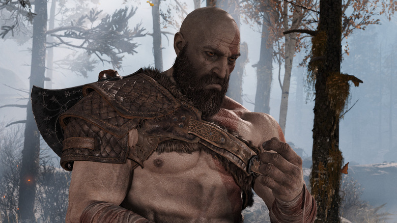 Kratos looking at his hand in God of War
