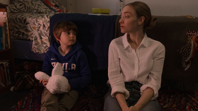 Amanda Seyfried as Mickey sitting next to Callum Vinson as Thomas Fitzpatrick on the floor of a bedroom in Long Bright River