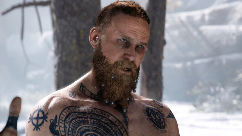 Jeremy Davies as the voice of Baldur standing in the snow with his arms spread wide in God of War