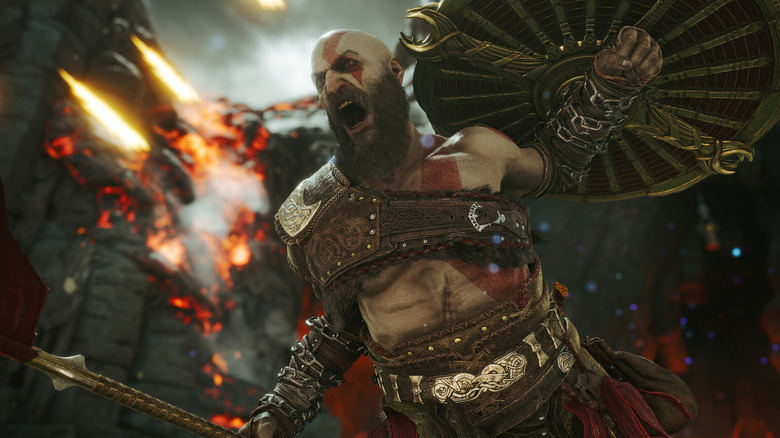 Kratos screaming with his shield held in the air in God of War Ragnarok
