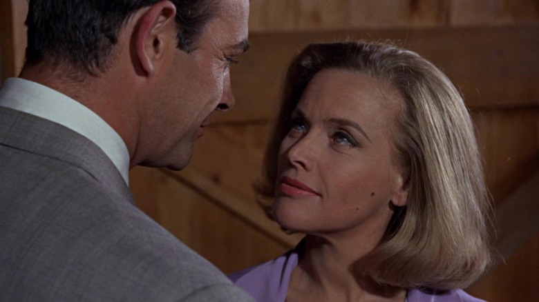 Honor Blackman as P***y Galore stares into the face of Sean Connery as James Bond in Goldfinger