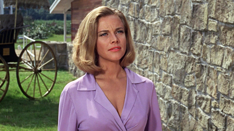 Honor Blackman as P***y Galore stands outside in Goldfinger