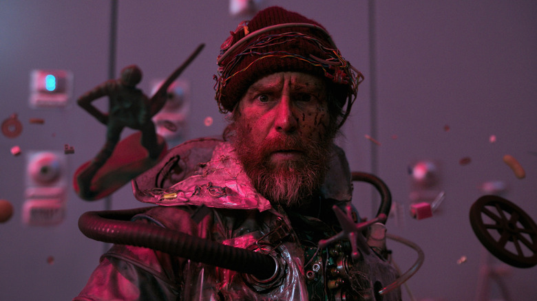 A man claiming to be fom the future surrounded by floating toys in Good Luck, Have Fun, Don't Die