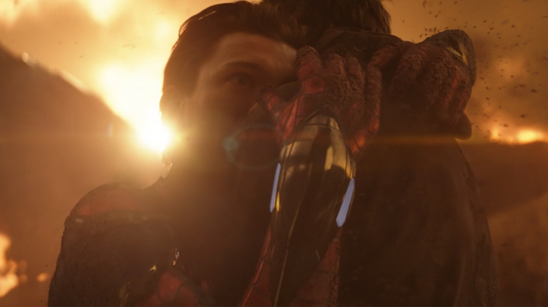 Spider-Man hugging Tony Stark and starting to disappear in Avengers: infinity War