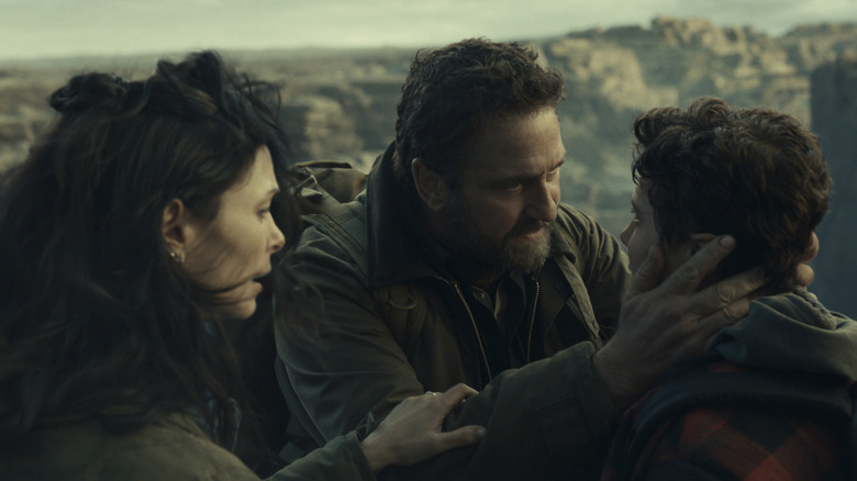 The Garrity family prepare to travel across a bridge in Greenland 2: Migration