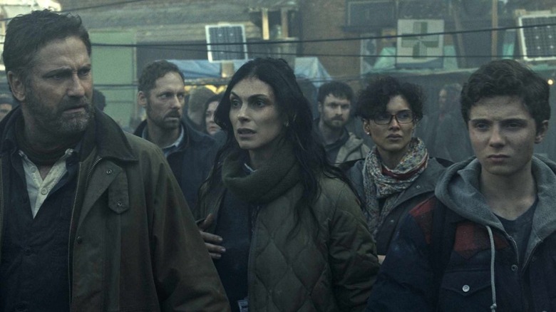 The Garrity family wandering the streets in "Greenland 2: Migration"