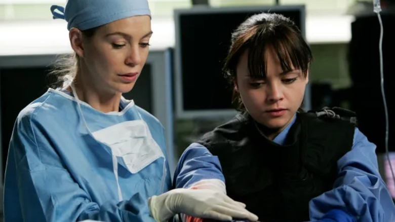 Meredith and Hannah with their hands in a body cavity on Grey's Anatomy