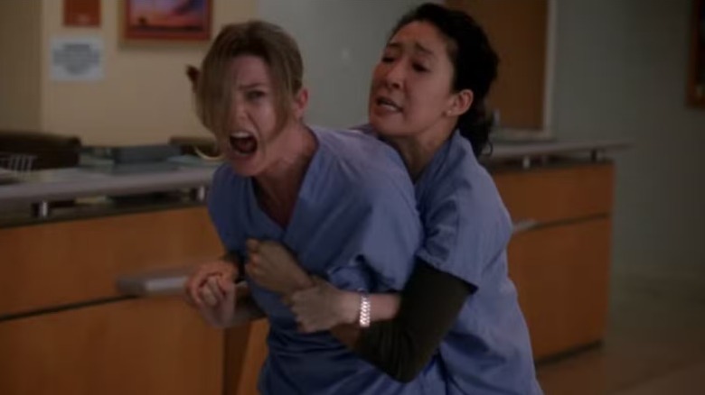 Christina holding Meredith back in Grey's Anatomy