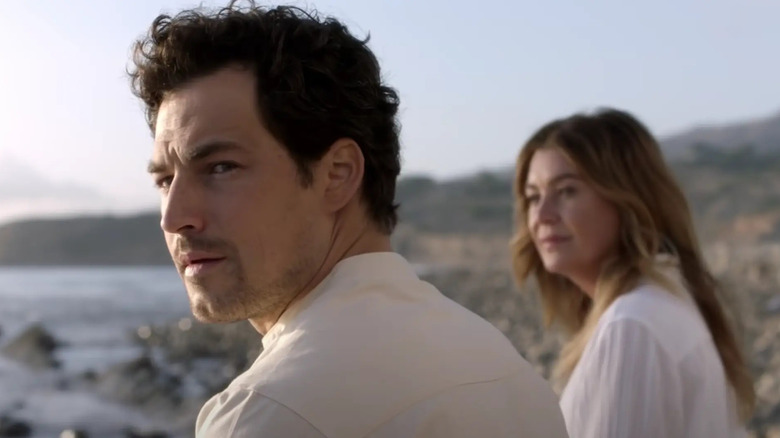 Andrew and Meredith sitting together on the coma beach on Grey's Anatomy