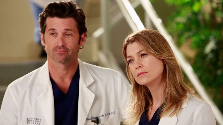 Derek and Meredith at work in white lab coats on Grey's Anatomy