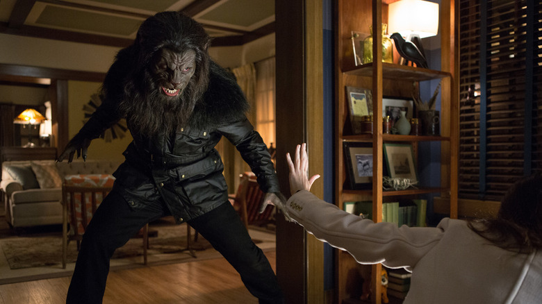 A blutbad getting ready to attack a woman in Grimm