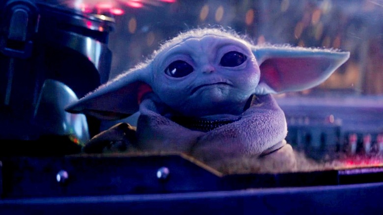 Grogu and Pedro Pascal in The Mandalorian