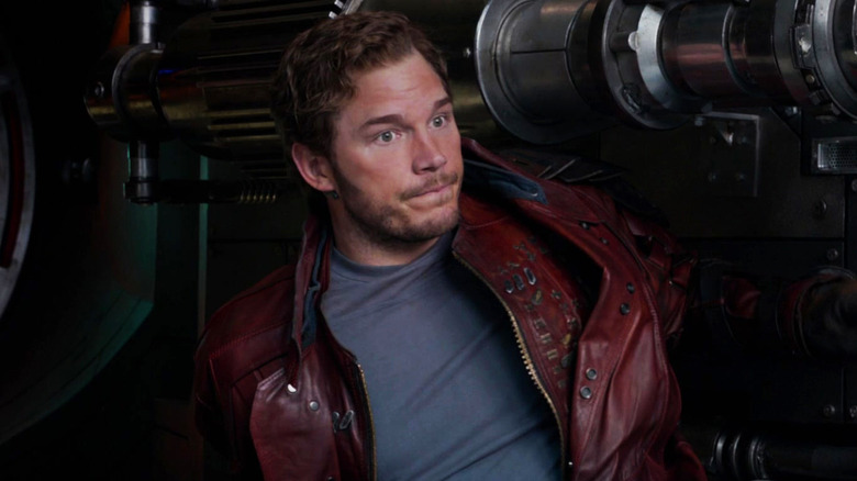 Star-Lord stands against wall of tech