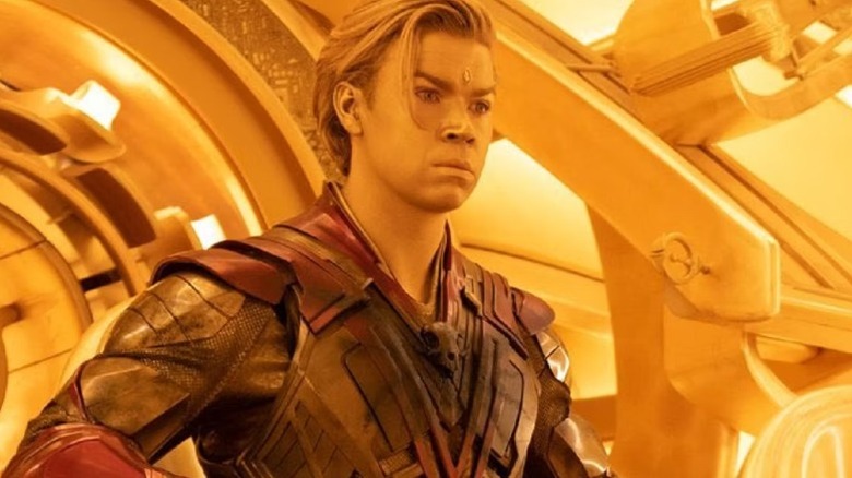 Golden Adam Warlock stands in a ship