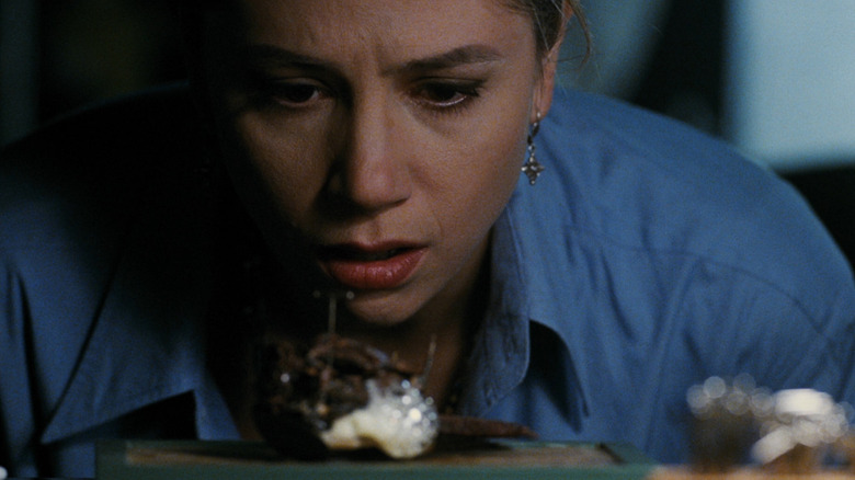 Dr. Tyler staring at a strange giant insect in Mimic