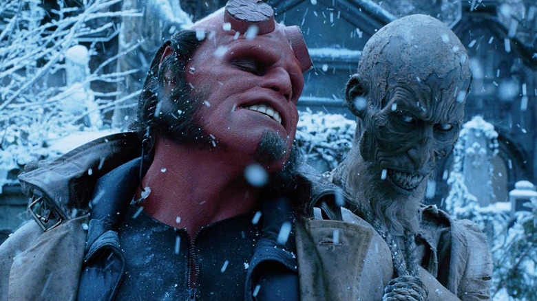 Ron Perlman as Hellboy carrying Ivan on his back in Hellboy (2004)