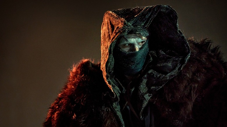 Frankenstein, Frankenstein's monster covered in dark winter clothing